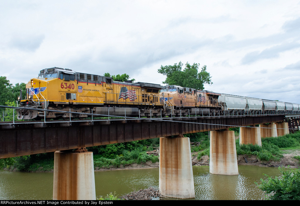 UP 6340 leads a grain train across Denton Creek